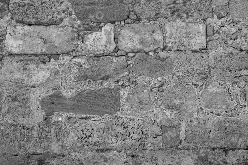 Preview: The Textured Fragment Closeup Of Old Stone Wall Of Ancient Fortress Of Monochrome Tone For A
