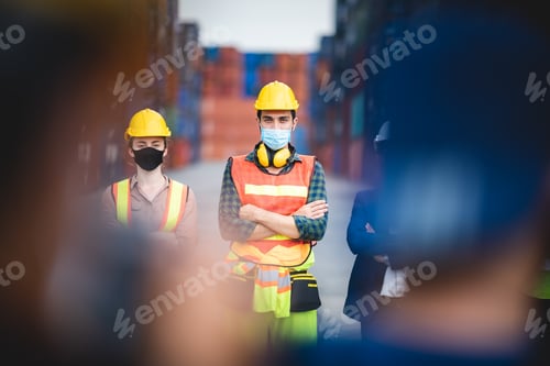Preview: worker group with engineer, foreman, and manager are wearing medical protection face mask