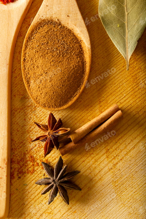 Preview: Spices on wood. Cinnamon, cinnamon sticks, star anise and bay leaf