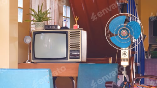 Preview: The old television and fan with household equipment in retro items inside of vintage house