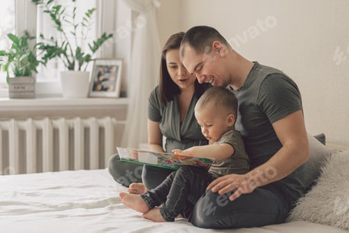 Preview: Family Love. Parents and Little Son Reading Book Together