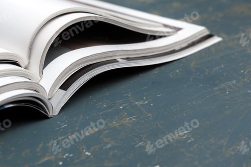 Preview: Close up stacking magazine place on table background