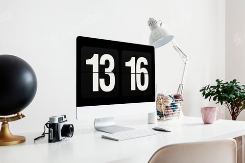 Preview: Camera and desktop computer on white desk with lamp in freelance