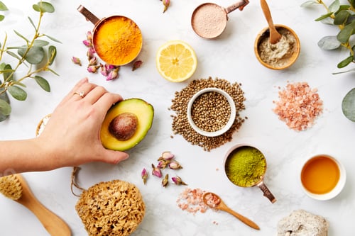 Preview: Overhead View Hand Arranging Natural Beauty And Health Products On Marble Background