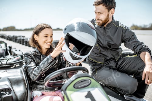 Preview: Young woman with instructor on the go-kart track