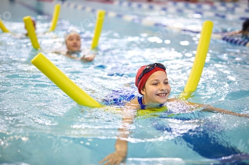 Preview: Little girls with swimming noodles in pool