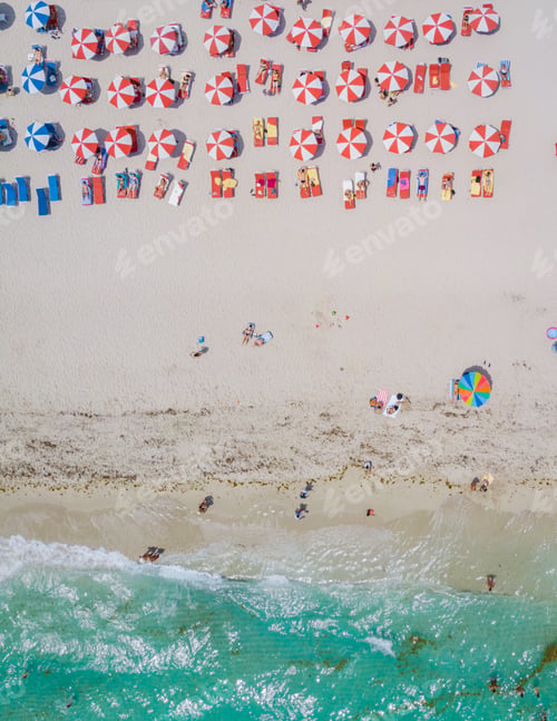Preview: Drone aerial view at Miami South Beach Florida, Beach with colorful chairs and umbrellas