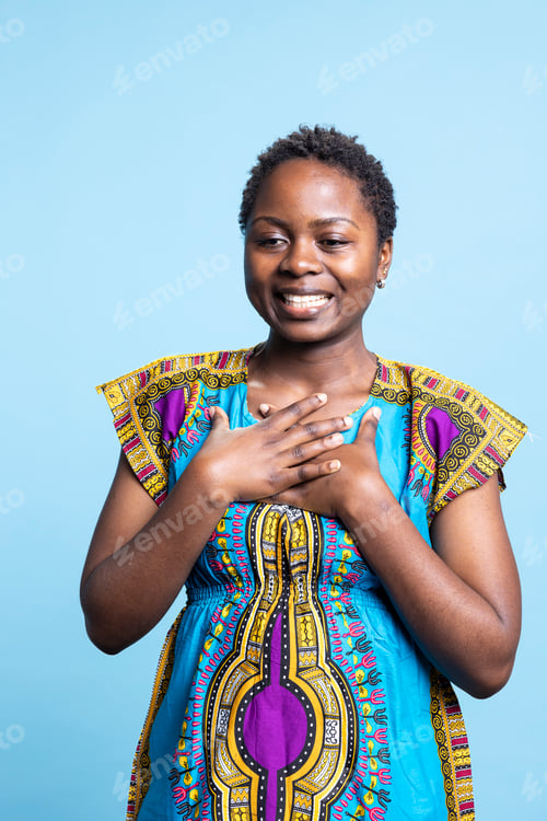 Preview: Young woman in colorful clothes being in shock over blue background
