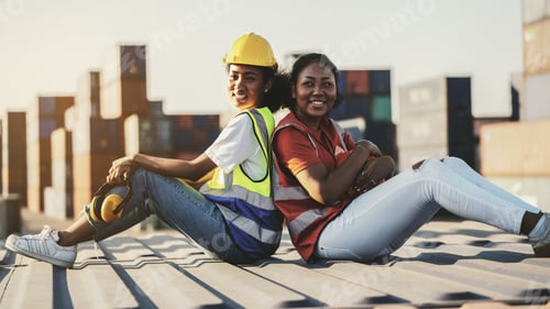 Preview: African american Woman foreman or inspector suppervisor sitting down behind each other on old cargo