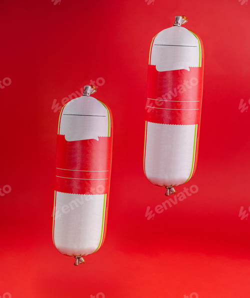 Preview: Two sausages hanging from above with blank labels on a red background