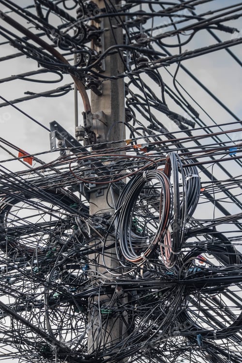 Preview: Close up of coiled power lines on pole