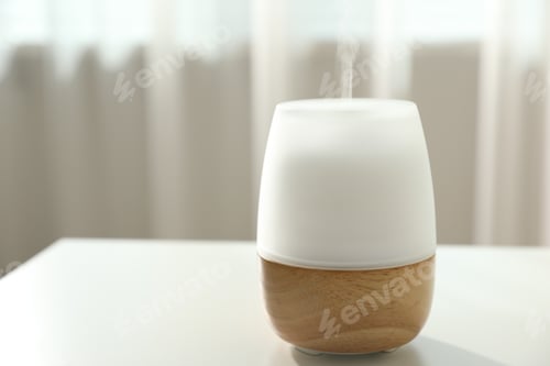 Preview: Modern aroma lamp on light table indoors, closeup. Space for text