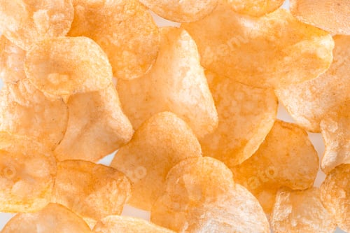 Preview: full frame view of unhealthy potato chips background on white