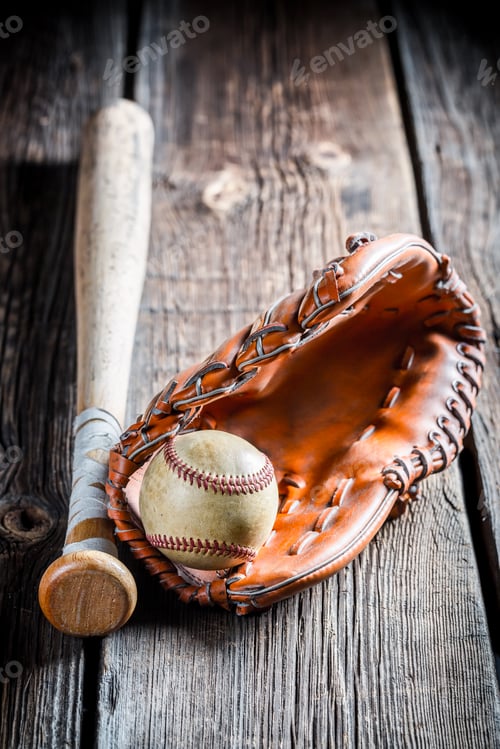 Preview: Vintage baseball glove and ball on old wooden table