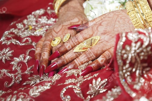 Preview: Henna and jewelry grace beautiful hands at a celebration