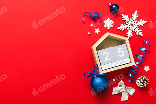 Preview: Christmas calendar 25 december. Christmas gift, fir branches, pine cones. Flat lay