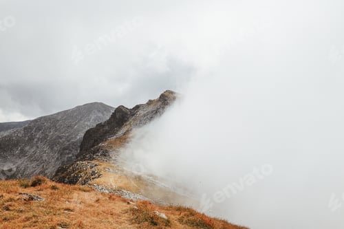 Preview: Dramatic Mountain Landscape with Clouds and Fog