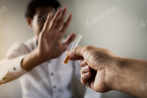 Preview: World No Tobacco Day in May, stop smoking concept, young man give cigarette but friend against
