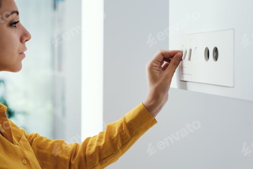 Preview: Woman checking settings on the boiler