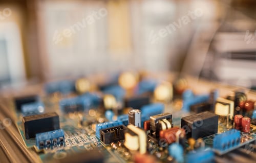 Preview: Close-up electric green embedded microcircuits in production