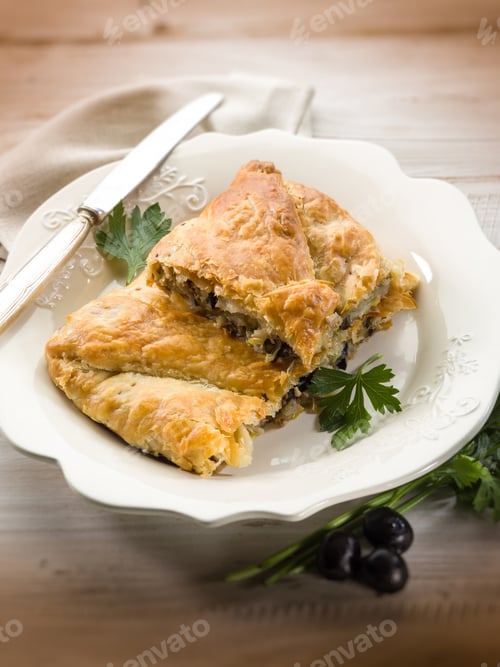 Preview: strudel stuffed with tuna and black olives, selective focus