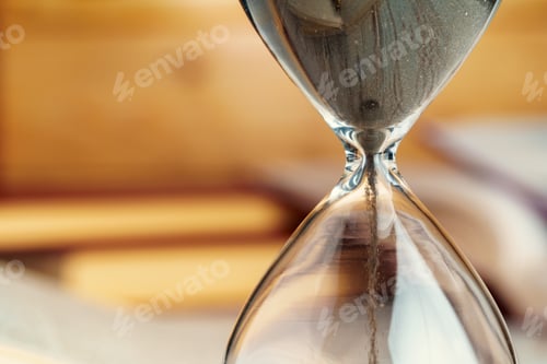 Preview: Sandglass clock close up on a table
