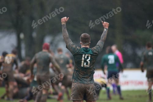 Preview: Closeup of dirty rugby players in the field