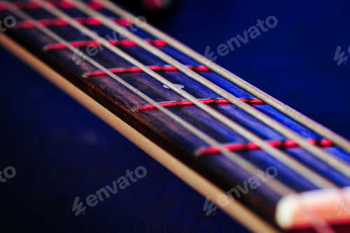 Preview: Guitar fingerboard with strings close up photo