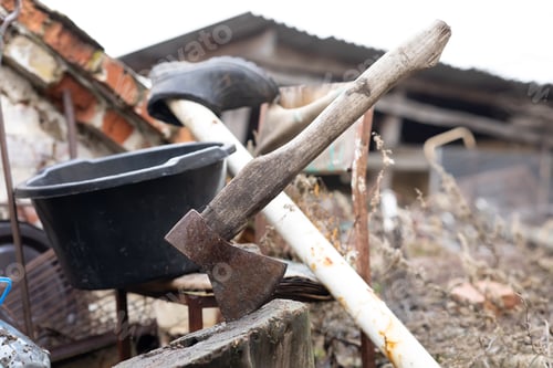 Preview: an old axe stuck in a stump