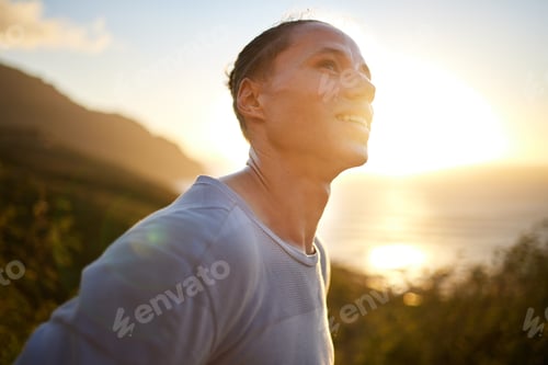 Preview: Its such a beautiful morning. Shot of a young taking a breather during his outdoor training.