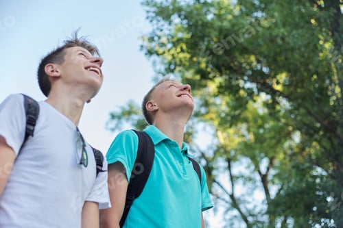 Preview: Outdoor portrait of smiling handsome young males
