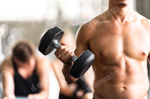 Preview: strong man exercising in the sport gym, workout exercise training in fitness for body strong