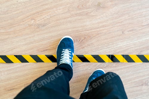 Preview: a person cross the black and yellow stop line, braking the limit concept