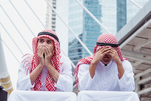 Preview: Handsome modern Arabian man standing in modern city wear muslim dress headscarf eastern ethnic