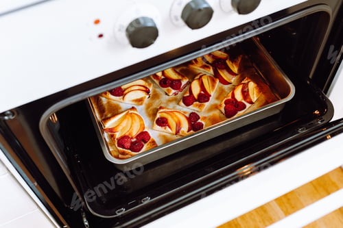 Preview: looking into oven, we check readiness of baked sweet pastries