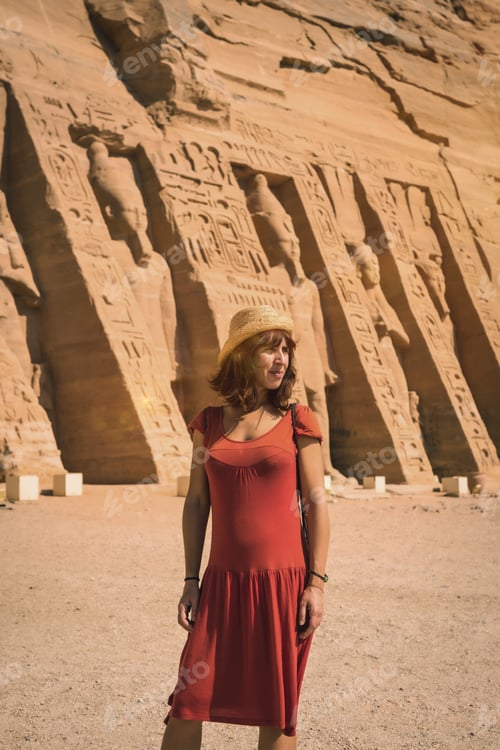 Preview: A young girl in red dress visiting the Egyptian Temple of Nefertari near Abu Simbel