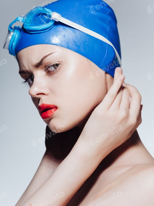 Preview: woman athlete in a swimming cap isolated background