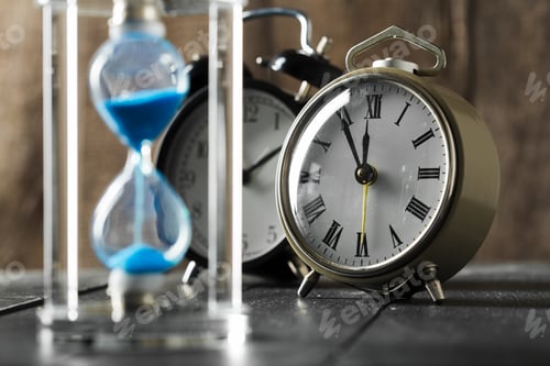 Preview: Time is passing. Blue hourglass close up