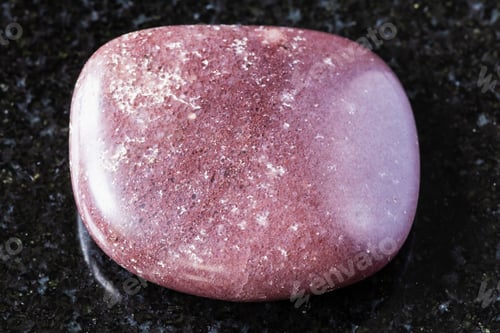 Preview: tumbled red brown quartzite rock on black