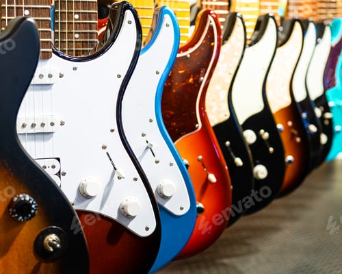 Preview: Row of electric guitars different color in a music instruments shop