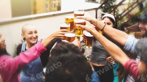 Preview: a group of young people from different ethnic backgrounds celebrating toasting with glasses of beer