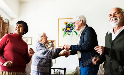 Preview: Senior friends dancing together at home