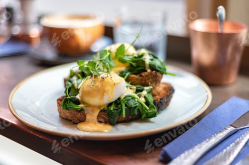 Delicious Eggs Benedict with Spinach for Breakfast