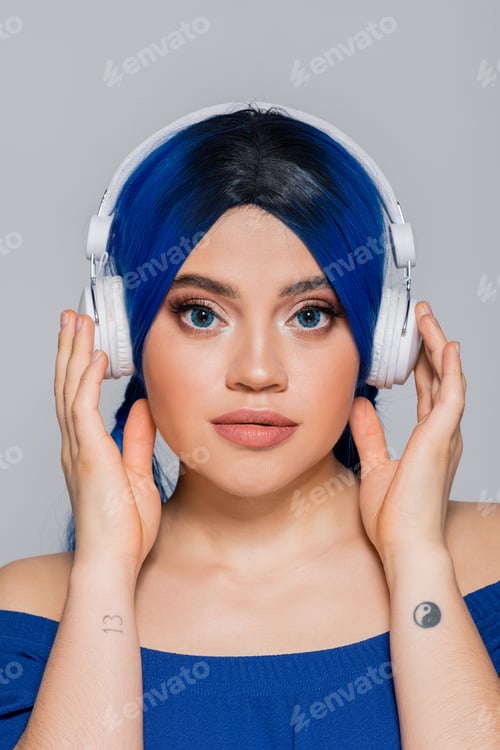 Preview: music lover, young woman with vibrant hair listening music in wireless headphones