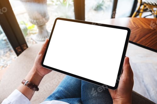 Preview: Mockup image of a woman holding black tablet pc with blank white desktop screen