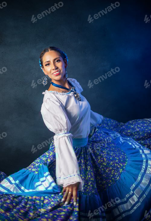 Preview: A woman in a blue skirt and white shirt is dancing
