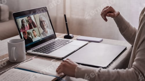 Preview: Back view of business people streaming online on video call conference - Main focus on keyboard
