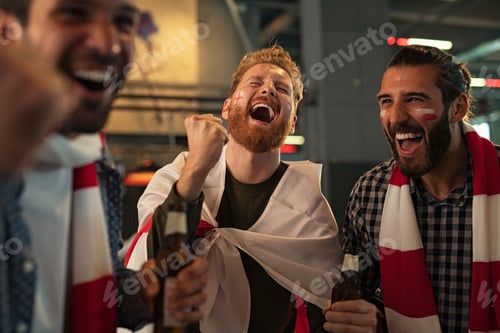 Preview: Friends celebrating victory in bar