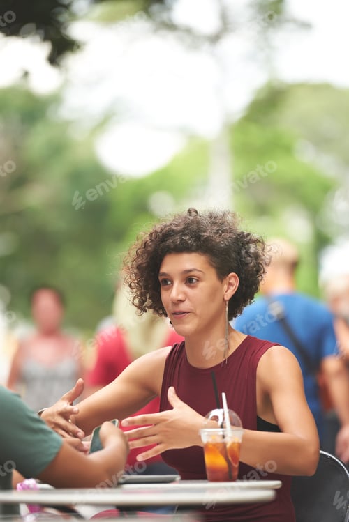 Preview: Positive Woman At Cafe Table
