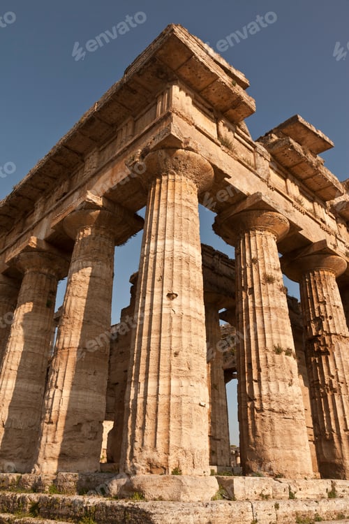 Preview: Majestic ancient Greek temple bathed in sunlight.